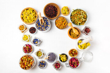 Assortment of dry herbal and berry tea on a wooden background. Tea party concept. medicinal herbs. Healing herbs.Alternative medicine.Linden, calendula, cornflowers, marigold, tansy, tea rose.