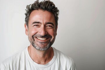 Fototapeta premium Portrait of a satisfied man in his 30s smiling at the camera isolated in white background