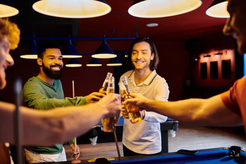 Friends raise their beers in a toast after a game of pool at a bar.