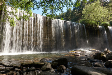 Pradillo Dam waterfall in the Sierra de Guadarrama National Park. Lozoya Valley. Madrid's...