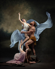 Muscular man lifts delicate woman while woman below supports her, all adorned in flowing fabrics,...