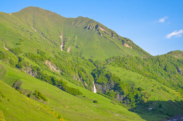 scenic view of Ganisi waterfall from Georgian Military Road (Gudauri, Georgia)