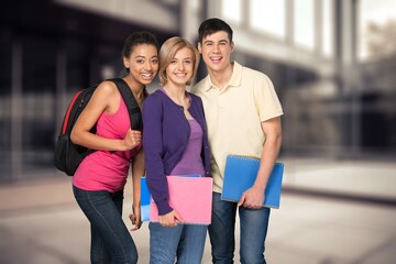 Happy young students Holding notepads