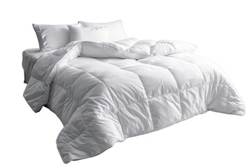A pristine white bed with a fluffy duvet and pillows, inviting and serene.