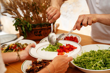 Serving Fresh Salad at a Gathering