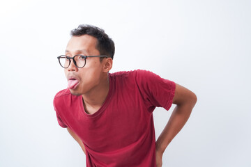a young man wearing a red t-shirt with a silly, funny expression