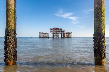 West Pier in the sea off the coast at Brighton, on a sunny summer's day