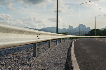 Roadside metal rail barrier structure which is installed on side of the road for protected the car...