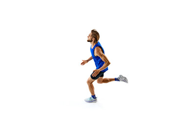 Athletic and determined man, runner in motion, training, growing speed for marathon isolated on white studio background. Concept of sport, marathon, competition, healthy and active lifestyle