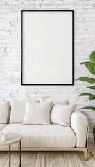 Minimalist living room with white sofa, cushions, green plant, coffee table, and blank picture frame on a white brick wall.