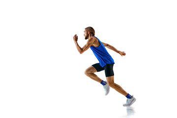 Dynamic image of competitive and forced man, muscular runner in motion, training isolated on white studio background. Concept of sport, marathon, competition, healthy and active lifestyle