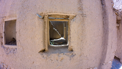 Photography of old abandoned adobe building near Nizwah in Oman during spring day