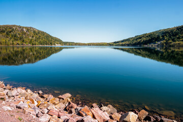 Fototapeta premium Looking north from the south shoreline to the northern shoreline of Devil's Lake, within Devil's Lake State Park, Baraboo, Wisconsin in early May