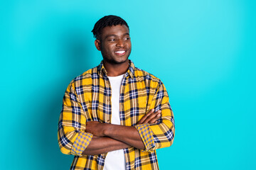 Photo of nice glad cheerful man wear stylish clothes look empty space isolated on cyan color...