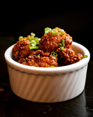 Deep fired salmon bites with green onions.