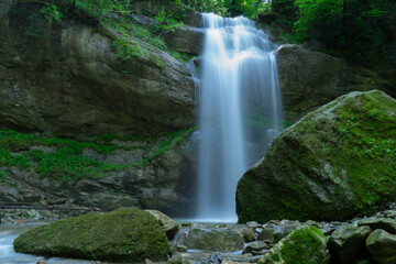 Obraz premium mustic waterfall in the forest in long exposure 