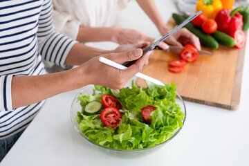 Woman making dessert and live recording.