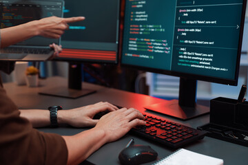 Serious of IT developers discussing intelligent website development coder system running data...