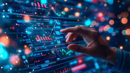 a hand touching a screen with graphs and charts