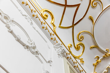 Classic luxury interior, white ceiling and wall decoration with golden pattern