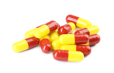 Many antibiotic pills isolated on white. Medicinal treatment