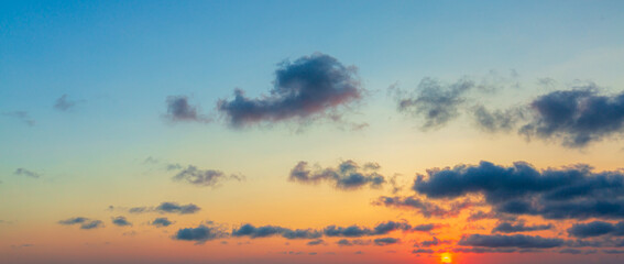 colorful clouds and sky,Dusk, Sunset Sky Clouds in the Evening with colorful Orange, Yellow, Pink and red sunlight and Dramatic storm clouds on Twilight sky, Landscape horizon