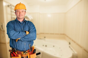 Plumber with instruments bag showing in bathroom