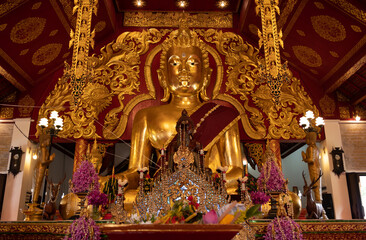 Beautiful big Buddha statue inside Viharn of Wat Klang Wiang temple in Chiang Rai province of Thailand.