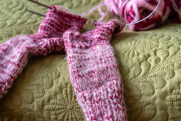 knitted socks, colored thread thread and needles, knitted in the Magic loop technique