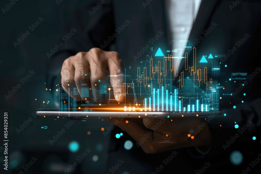 Aufkleber Man holding a tablet with graphical data, suitable for use in business or financial contexts