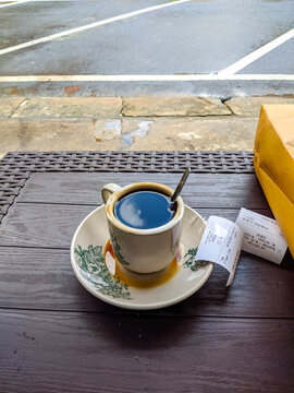 Traditional black coffee served at a Pontianak coffee stall, presented in a classic cup with simple setting, capturing authentic local caf&eacute; culture and everyday Indonesian coffee ritual. Warkop Ponti