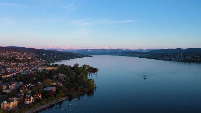 Zurich Lake and Swiss Alps on Sunny Day. Snow-Capped Mountains. Switzerland. Aerial View. Drone Moves Forward