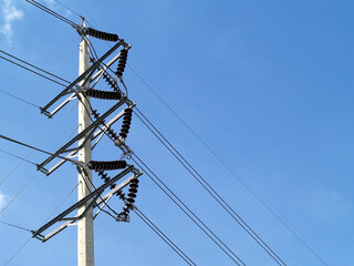 high voltage power lines connected to electrical insulators on steel beam