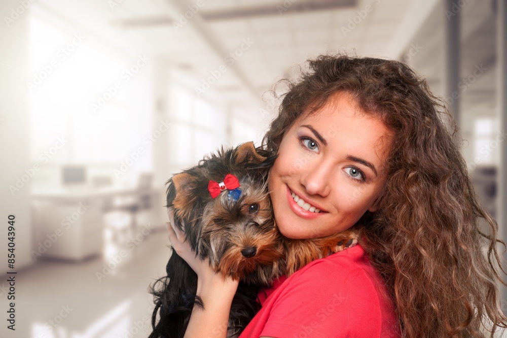 Poster Young woman holds and hugs cute dog