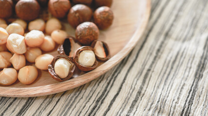 Organic Macadamia nut. macadamia nuts are cracked and baked to taste extremely delicious superfood fresh natural shelled unsalted raw macadamia and healthy food concept