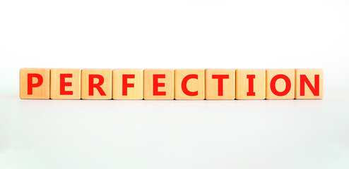 Perfection symbol. Concept word Perfection on beautiful wooden blocks. Beautiful white background. Business perfection concept. Copy space.