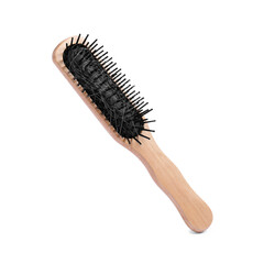 Wooden brush with lost hair in air on white background