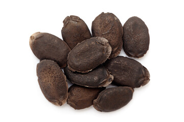 Close-up of Dried Organic Sponge Gourd (Luffa aegyptiaca) seeds, isolated on a white background. Top view.