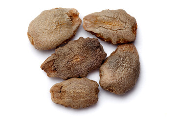 Close-up of Dried Organic Snake Gourd (Trichosanthes cucumerina) seeds, isolated on a white background. Top view.