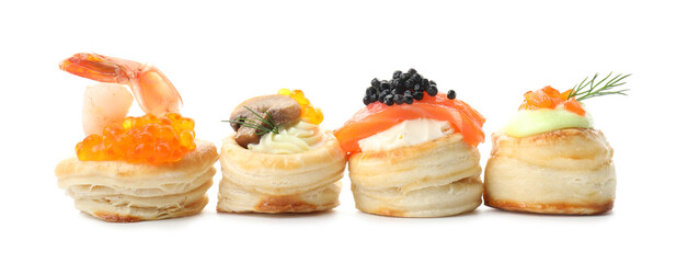 Different delicious puff pastry snacks isolated on white