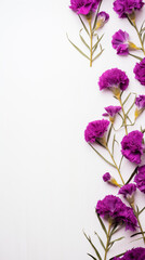 Fototapeta premium Frame of purple flowers on white background. Copy space.