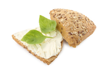 Pieces of bread with cream cheese and basil leaves isolated on white