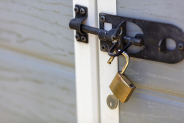 Secure Locked Gate with Metal Padlock Daytime Close-up, Security Concept, Protection, Safety Detail Photography, Metal Lock and Latch on Wooden Gate, Home and Property Security Measures