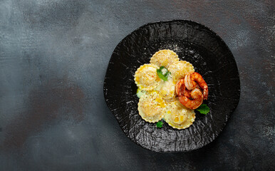 ravioli with shrimp, in cream sauce, with spices and herbs, top view, no people,