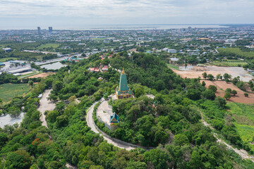 Fototapeta premium Aerial view of temple located on top of mountain in Thailand.