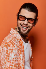 Obraz premium Stylish bearded man in shades and jacket.