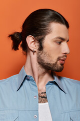 A handsome Caucasian man with a long ponytail and beard