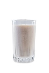 Banana milkshake with banana slices in a glass on a white isolated background