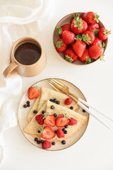 Summer breakfast. French homemade pancake crepes. Top view