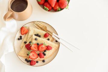 Summer breakfast. French homemade pancake crepes. Top view